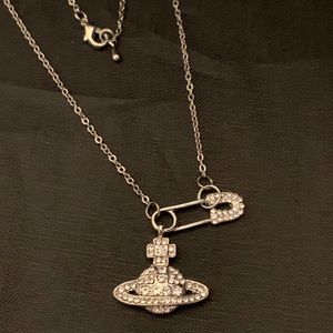 Safety pin cross Saturn ufo silver crystals Vivianne necklace